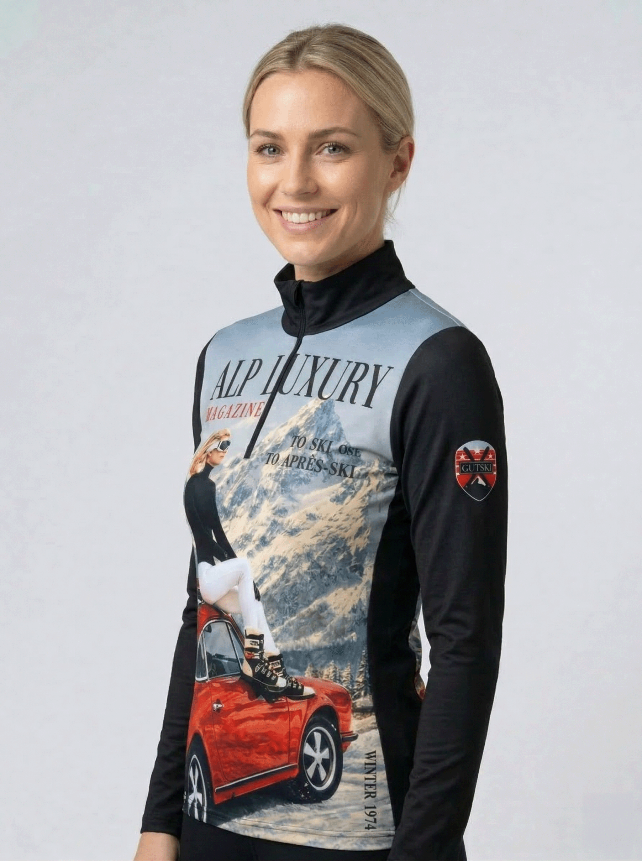 Zwarte dames skipully met halve rits en retro jaren 70 Alp Luxury magazine design van Gutski