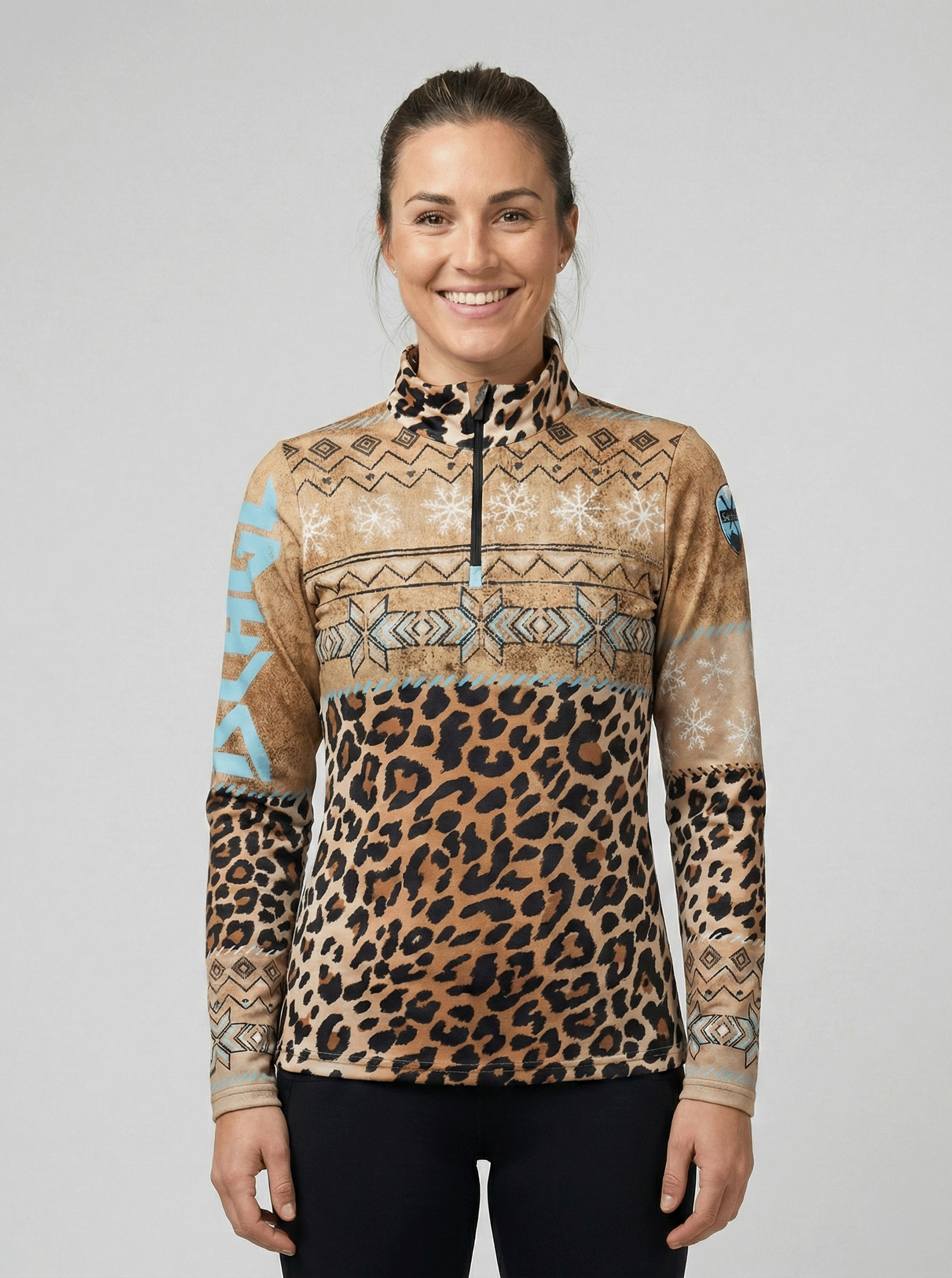 Gutski dames skipully voorkant met panterprint en turquoise accenten.