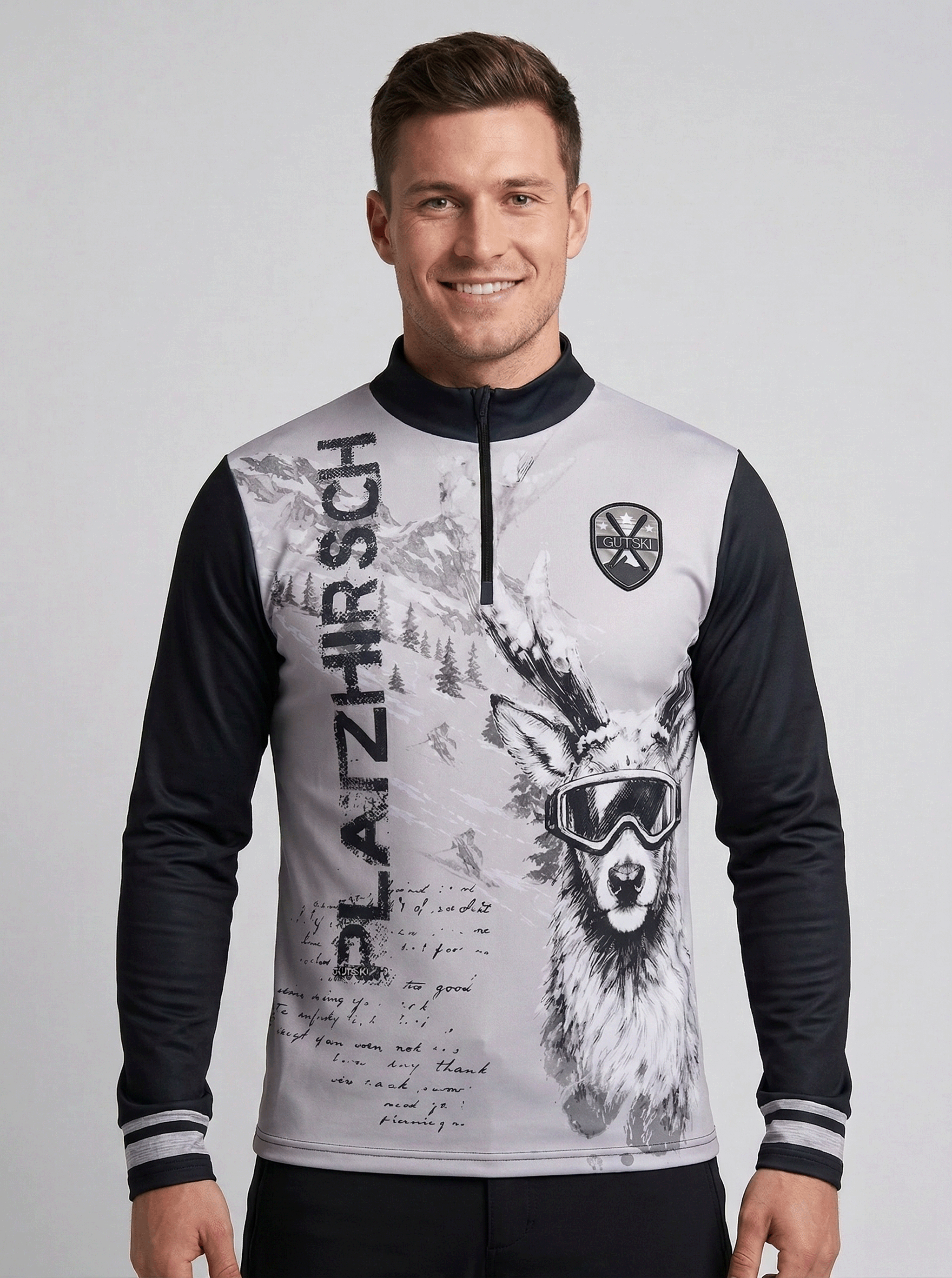 Gutski Platzhirsch Grey skipully voor heren met grijze romp, zwarte mouwen en hert met skibril print.